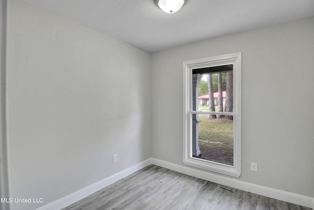 empty room with light wood-type flooring