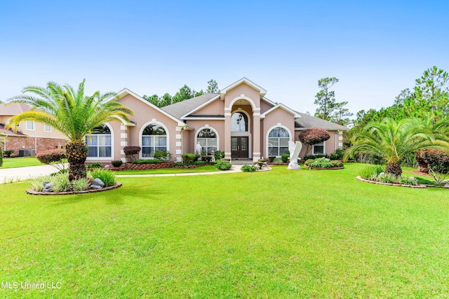 single story home featuring a front yard