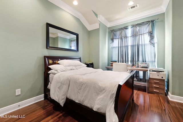 bedroom with dark wood-type flooring and ornamental molding