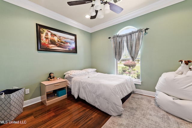 bedroom with ceiling fan, hardwood / wood-style flooring, and crown molding