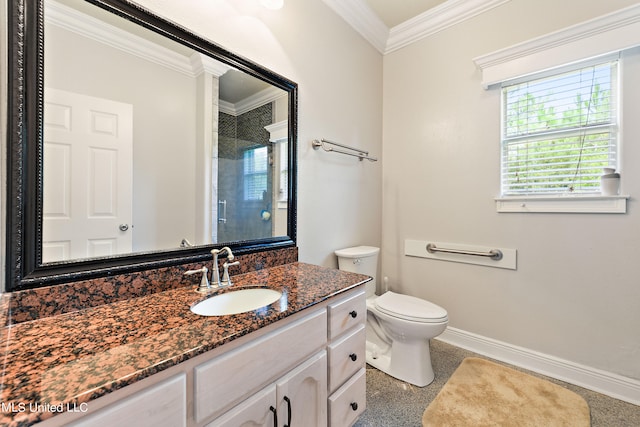 bathroom with toilet, crown molding, vanity, and tiled shower