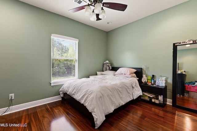 bedroom featuring dark hardwood / wood-style flooring and ceiling fan