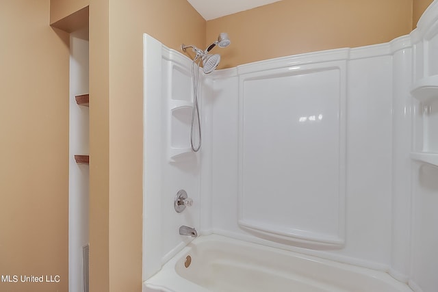 bathroom with shower / washtub combination