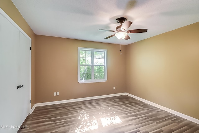 unfurnished room with a textured ceiling, hardwood / wood-style flooring, and ceiling fan