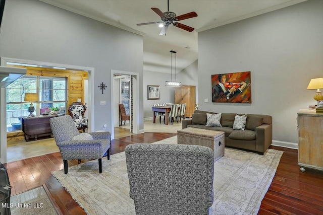 living room featuring crown molding, hardwood / wood-style flooring, high vaulted ceiling, and ceiling fan