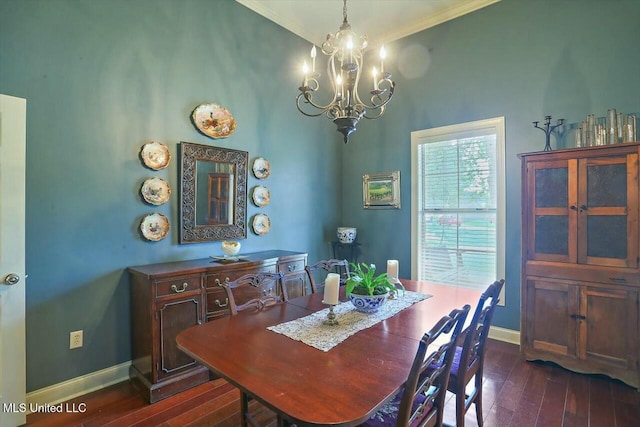 dining area featuring an inviting chandelier, crown molding, and dark wood-type flooring