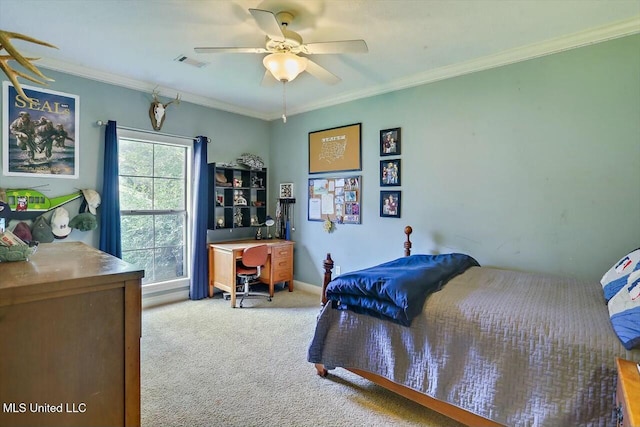 carpeted bedroom featuring crown molding and ceiling fan