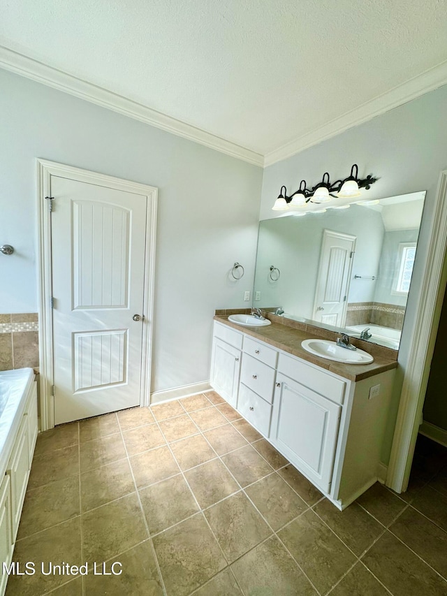 bathroom featuring tile patterned flooring, crown molding, vanity, a textured ceiling, and a bath