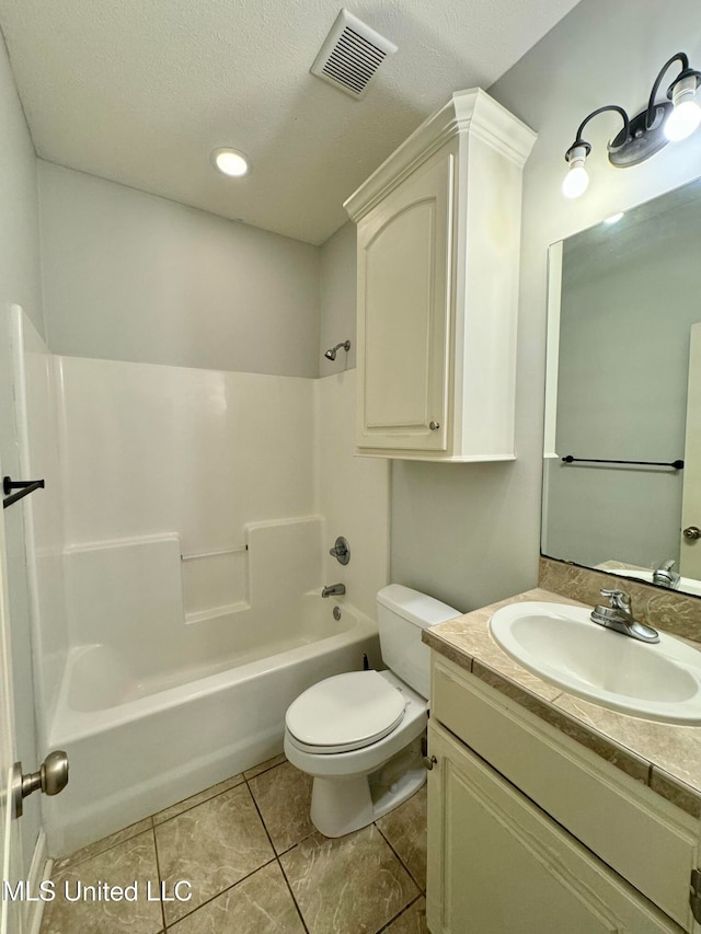 full bathroom with toilet, a textured ceiling, vanity, and tub / shower combination