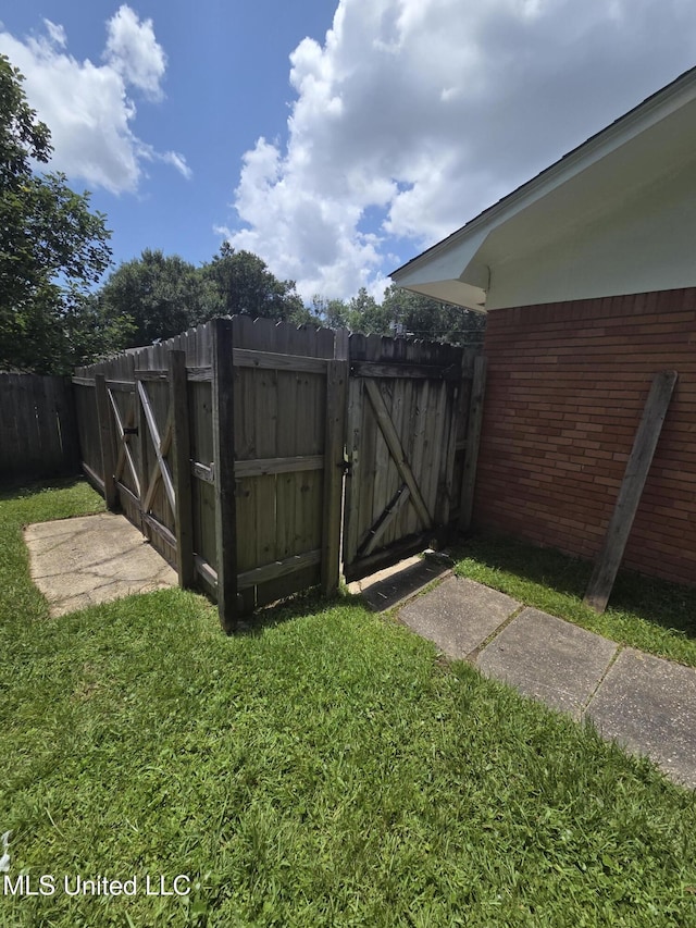 1442 Tally Ho Cir, Gulfport, MS 39507 - view of yard with a gate