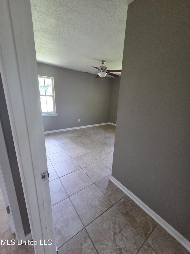 1442 Tally Ho Cir, Gulfport, MS 39507 - tiled spare room with ceiling fan and a textured ceiling