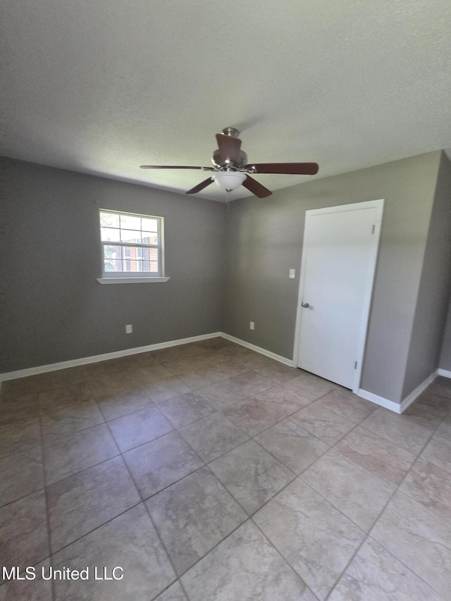 1442 Tally Ho Cir, Gulfport, MS 39507 - tiled spare room featuring a ceiling fan and baseboards
