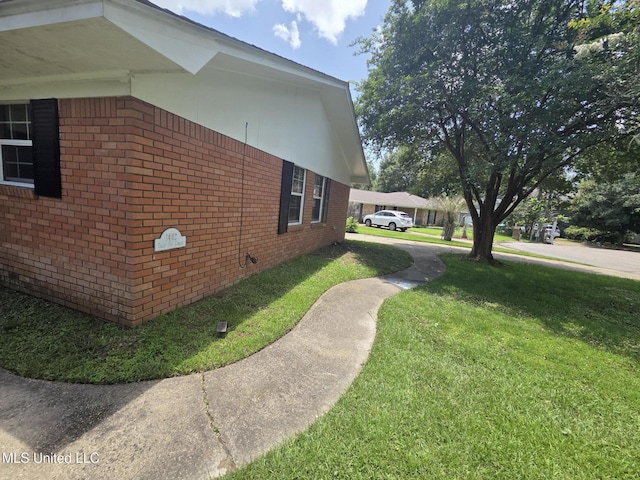 1442 Tally Ho Cir, Gulfport, MS 39507 - view of side of home with brick siding and a lawn