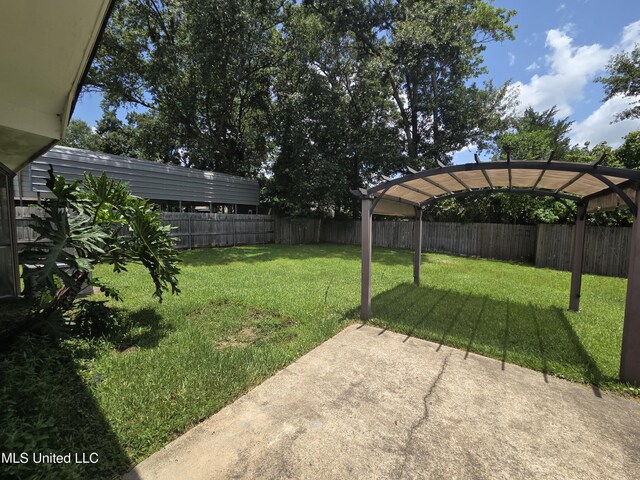 1442 Tally Ho Cir, Gulfport, MS 39507 - fenced backyard with a patio area