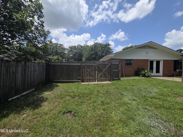 1442 Tally Ho Cir, Gulfport, MS 39507 - fenced backyard featuring french doors and a gate