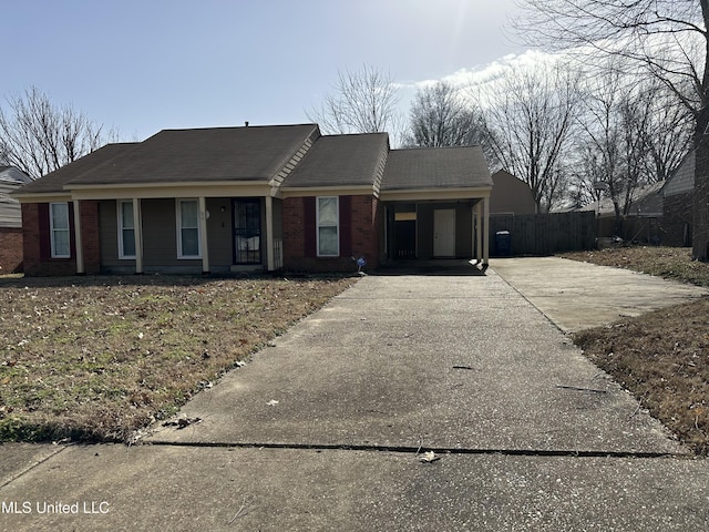 single story home featuring a carport