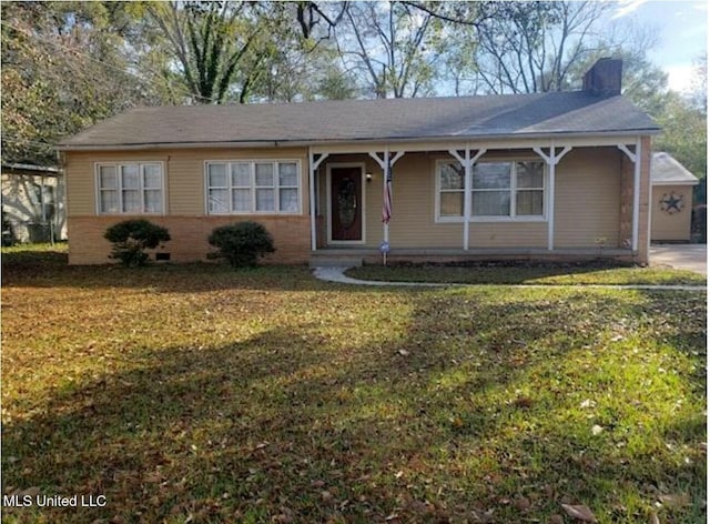 ranch-style house with a chimney, covered porch, and a front yard