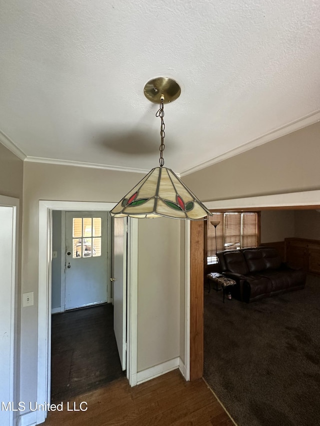 corridor featuring a textured ceiling and ornamental molding