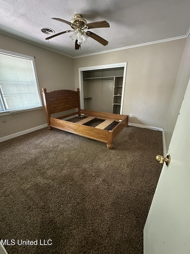 unfurnished bedroom with visible vents, carpet flooring, and crown molding