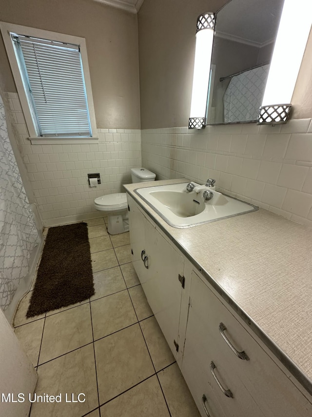 bathroom featuring tile walls, tile patterned flooring, ornamental molding, and a shower with curtain
