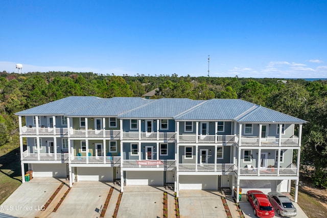 view of front of house with a balcony and a garage