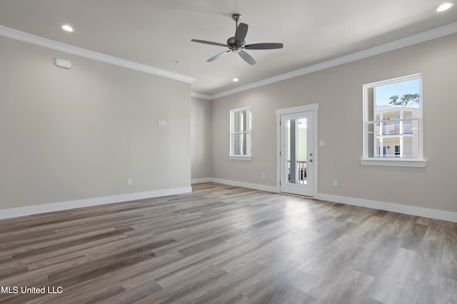 empty room with light hardwood / wood-style floors, ornamental molding, and ceiling fan