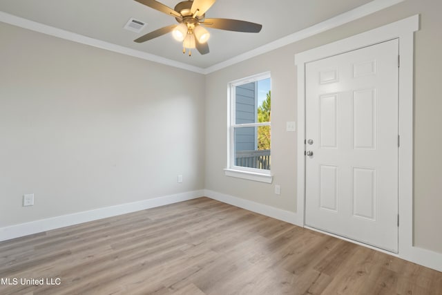 entrance foyer with crown molding, light hardwood / wood-style flooring, and ceiling fan