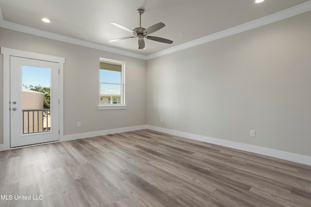 spare room with ornamental molding, light hardwood / wood-style flooring, and ceiling fan