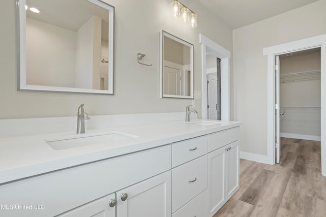 bathroom featuring vanity and hardwood / wood-style floors