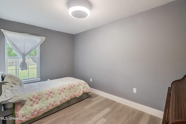 bedroom featuring hardwood / wood-style flooring