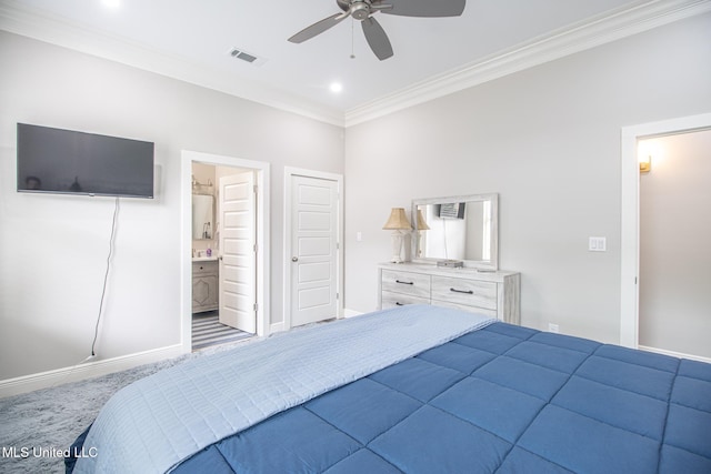 carpeted bedroom featuring ceiling fan, ornamental molding, and ensuite bath