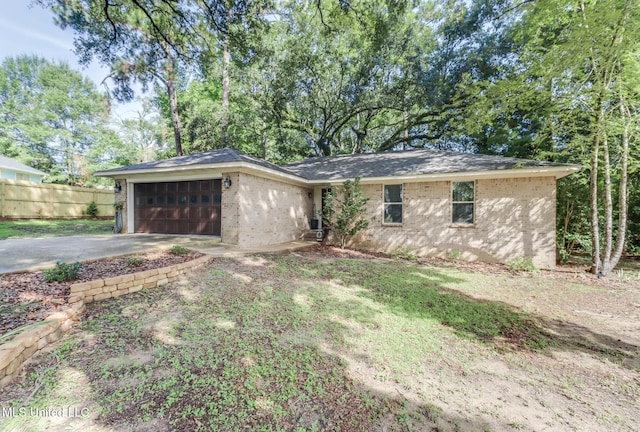 8707 Pine Ridge Ct, Diamondhead, MS 39525 - back of property featuring a garage, driveway, and brick siding