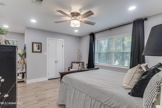 8707 Pine Ridge Ct, Diamondhead, MS 39525 - bedroom with light wood-style flooring, ceiling fan, and recessed lighting