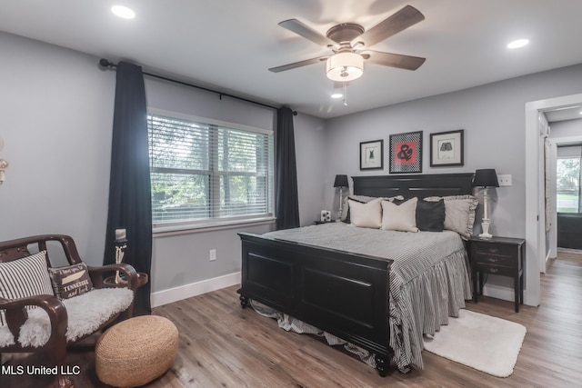 8707 Pine Ridge Ct, Diamondhead, MS 39525 - bedroom with wood finished floors, recessed lighting, and a ceiling fan