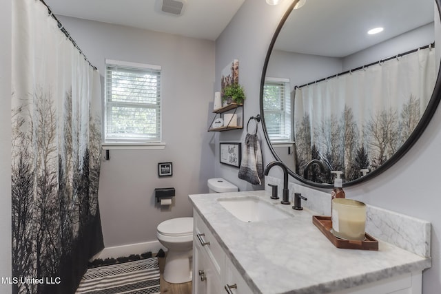 8707 Pine Ridge Ct, Diamondhead, MS 39525 - bathroom featuring vanity and toilet