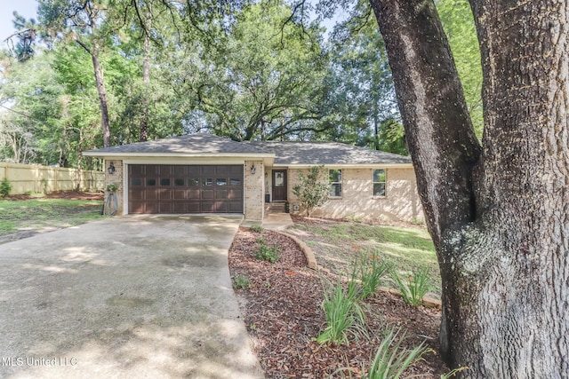 8707 Pine Ridge Ct, Diamondhead, MS 39525 - ranch-style house with driveway, an attached garage, brick siding, and a shingled roof