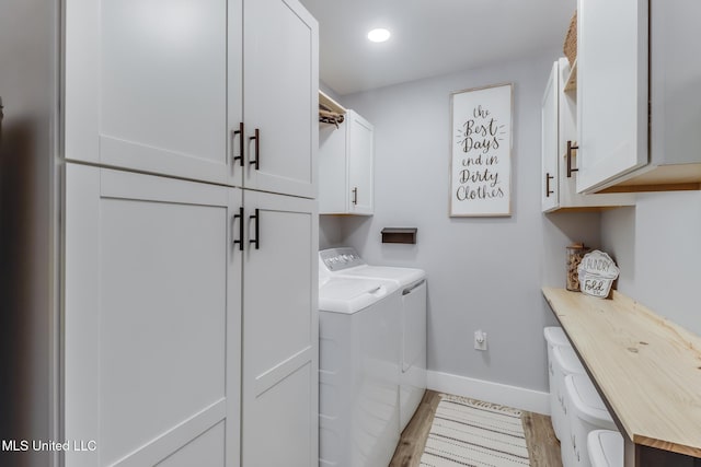 8707 Pine Ridge Ct, Diamondhead, MS 39525 - laundry area featuring cabinet space, independent washer and dryer, and recessed lighting