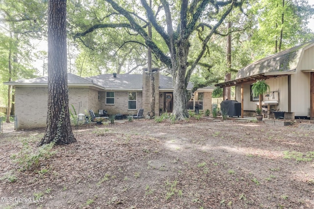 8707 Pine Ridge Ct, Diamondhead, MS 39525 - back of property with brick siding
