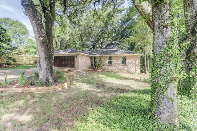 8707 Pine Ridge Ct, Diamondhead, MS 39525 - view of front facade with an attached garage and concrete driveway