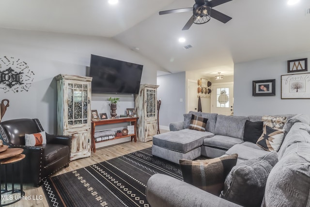 8707 Pine Ridge Ct, Diamondhead, MS 39525 - living area with lofted ceiling, ceiling fan, and light wood-style floors