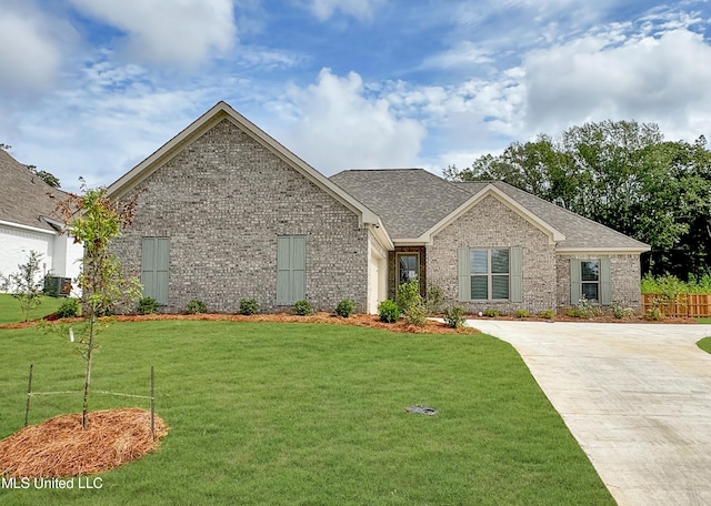 165 Cornerstone Dr, Brandon, MS 39042 - ranch-style house featuring brick siding, a front lawn, roof with shingles, and fence