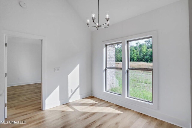 165 Cornerstone Dr, Brandon, MS 39042 - unfurnished dining area featuring plenty of natural light, wood finished floors, and a chandelier