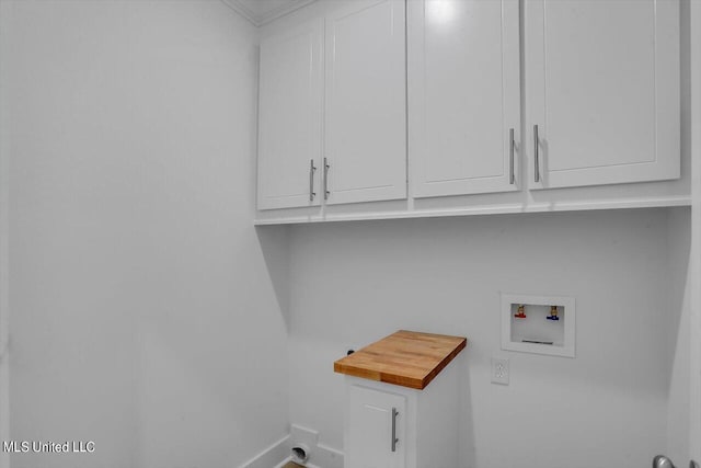 165 Cornerstone Dr, Brandon, MS 39042 - laundry area featuring cabinet space, baseboards, and hookup for a washing machine