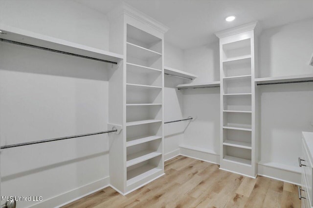 165 Cornerstone Dr, Brandon, MS 39042 - walk in closet with wood finished floors