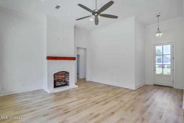 165 Cornerstone Dr, Brandon, MS 39042 - unfurnished living room with visible vents, ornamental molding, ceiling fan, and wood finished floors