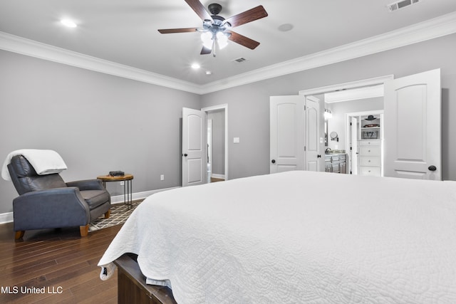 bedroom with crown molding, dark wood-type flooring, and baseboards