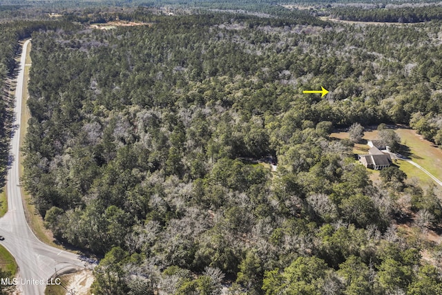 drone / aerial view with a view of trees