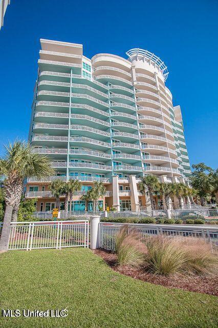 2230 Beach Dr Unit 808, Gulfport, MS 39507 - view of building exterior with fence
