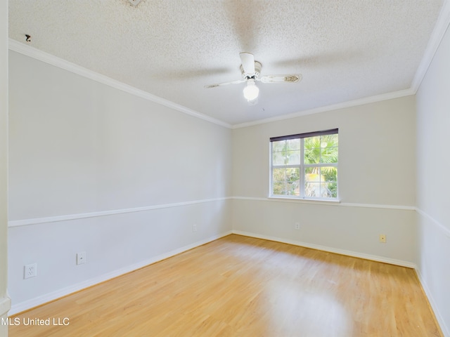 unfurnished room featuring hardwood / wood-style floors, ornamental molding, and a textured ceiling