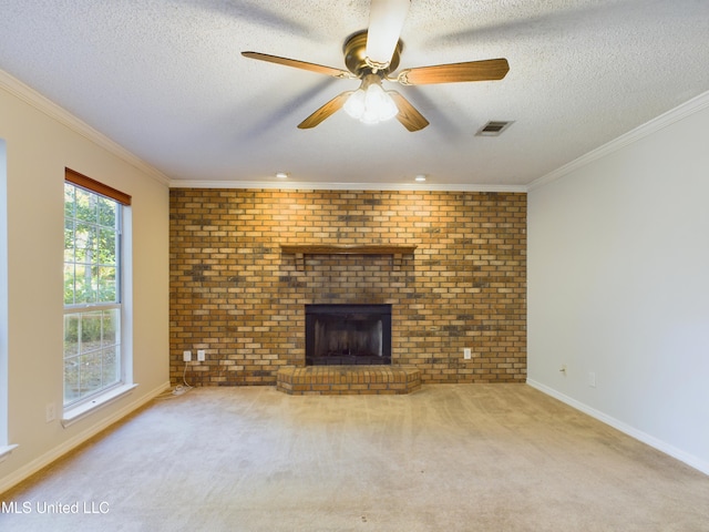 unfurnished living room with light colored carpet, brick wall, and a brick fireplace